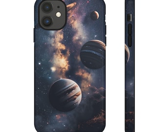 May include: A phone case featuring a galaxy and planets design. The case is black with a dark blue background and depicts a galaxy with stars and planets in shades of brown, orange, and white.