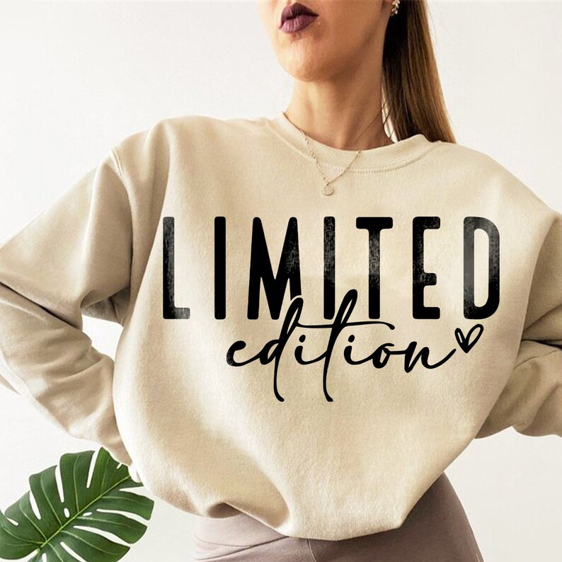 May include: A beige sweatshirt with the text "LIMITED edition" printed in black with a small heart symbol.