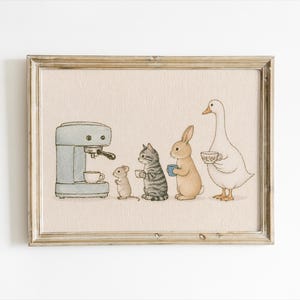 May include: A framed illustration on a light beige background featuring a light blue espresso machine, a small mouse, a grey tabby cat, a tan rabbit, and a white goose. Each animal is holding a small teacup or mug in a line next to the machine.