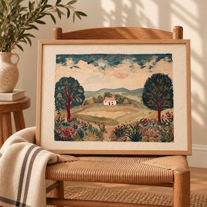 May include: A framed landscape painting featuring a small white house with a red roof centered in a field. Two large dark green trees frame the scene, with a foreground of colorful flowers and a background of rolling hills under a cloudy sky.