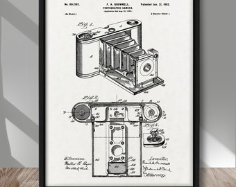 May include: A black and white line drawing of a photographic camera patent, No. 691,532, patented 21st January 1902, by F. A. Brownell. The patent drawing shows a detailed illustration of the camera's design, including its various parts and mechanisms.