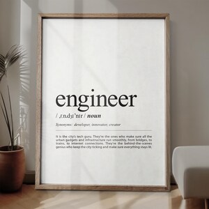 May include: A wooden-framed print displaying the word "engineer" in black, with its pronunciation, part of speech, and synonyms. The text below describes the engineer's role in urban infrastructure and technology.