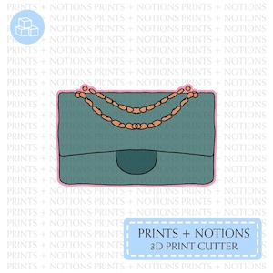 May include: A teal blue handbag with a gold chain strap. The bag has a flap closure and a small pocket on the front. The image includes the text "PRINTS + NOTIONS 3D PRINT CUTTER".