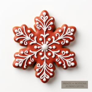 May include: A red gingerbread cookie in the shape of a snowflake with white icing and white dots. The cookie is decorated with a white snowflake design. The text "PRINTS + NOTIONS 3D PRINT CUTTER" is printed on a brown rectangle at the bottom of the image.