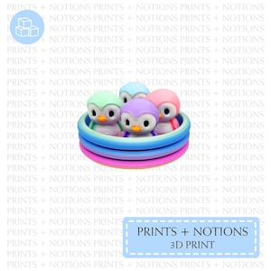 May include: A 3D-printed toy featuring five colorful penguin figurines inside a multi-colored circular pool. The penguins are in shades of green, blue, purple, and pink. The text "PRINTS + NOTIONS 3D PRINT" is in a light blue rectangle.