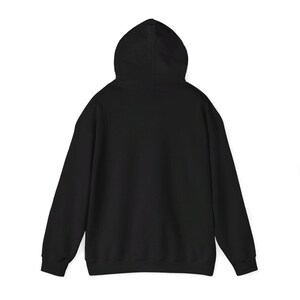 May include: A black hooded sweatshirt with a drawstring hood. The sweatshirt has long sleeves and a kangaroo pocket.
