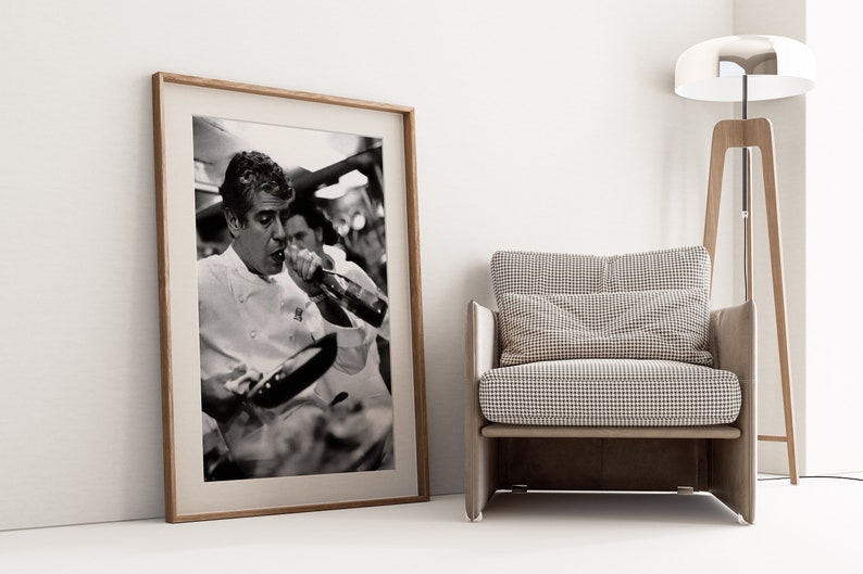 a framed photograph of a tennis player next to a chair