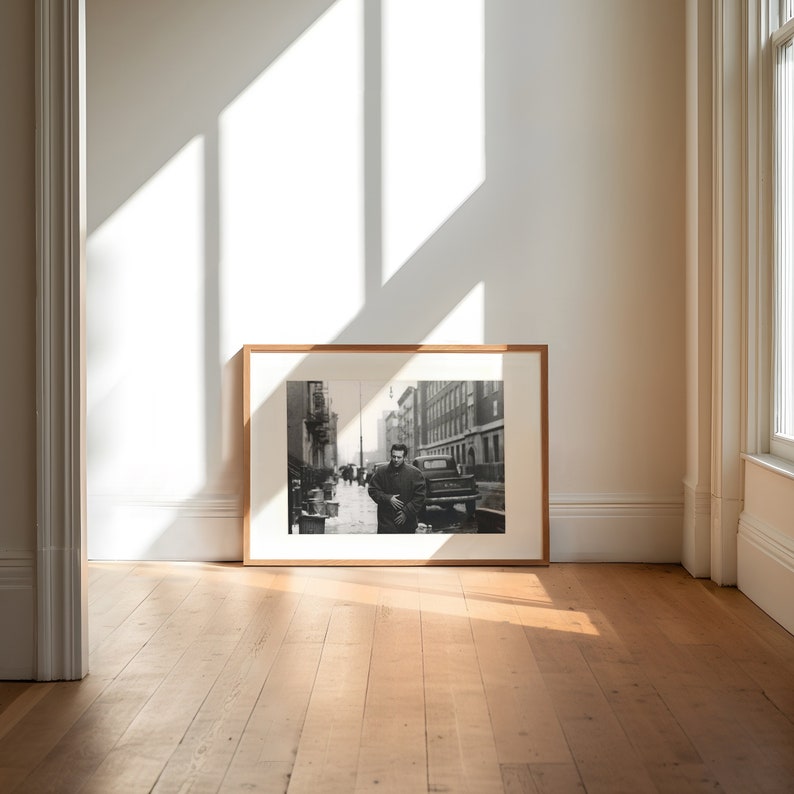 a picture frame sitting on a hard wood floor