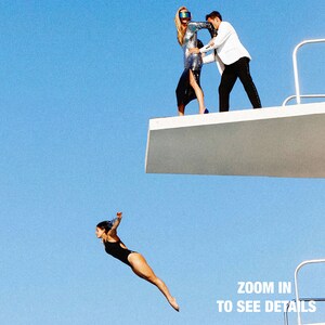 a man and a woman jumping off a diving platform