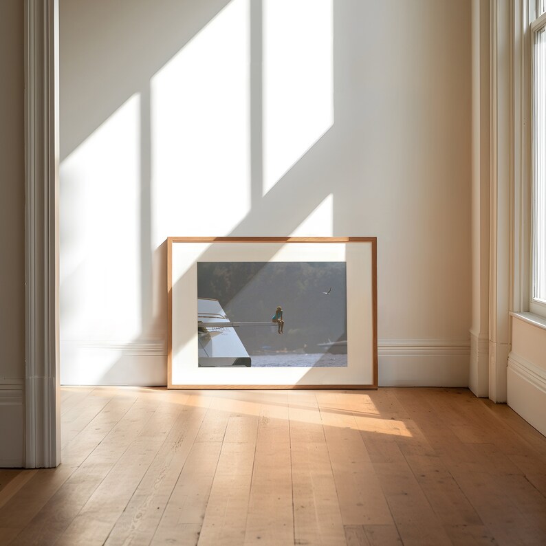 a picture frame sitting on a hard wood floor
