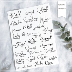 May include: A sheet of black and white printable stickers with various words and phrases in German. The words include "Wald", "Krenpel", "Schnick Schnack", "Singlebörse", "Medizin", "Gedanken", "Klimbim", "Notfall", "Kriebelfraus", "Zeit", "Little Beauty", "Strand", "Kinder", "Survival", "Gedöns", "Sammel", "Organizer", "Zettel", "Tüdel", "File", "Wechsel", "Plunder", "Regen".