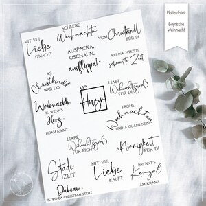 May include: A set of 10 black and white printable Christmas stamps with various designs and sayings in German. The stamps include phrases like "Liebe Weihnachten", "Frohe Weihnachten", and "Stade Zeit Daboam".