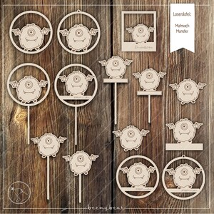 以下が含まれることがあります： レーザーカットされた木製のモンスターデザイン12個セット。デザインには、片目、翼、さまざまなポーズのモンスターが数多く含まれています。これらのデザインは、装飾、オーナメント、パーティーの記念品など、クラフトプロジェクトに最適です。