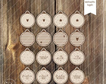May include: Wooden Christmas ornament cutouts in various designs, including hearts, stars, stripes, and polka dots. Some ornaments have text such as "Merry Christmas" and "For You". The ornaments are arranged on a wooden surface.