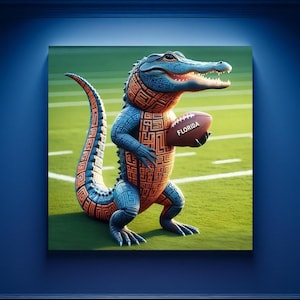 May include: A blue and orange alligator mascot holding a football with the word "FLORIDA" on it. The mascot is standing on a green field.