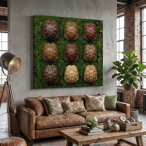 May include: A square canvas art piece featuring nine turtle shells arranged in a grid pattern against a backdrop of green moss. The shells display various shades of brown and tan, creating a natural, earthy aesthetic. The artwork hangs above a brown leather sofa.