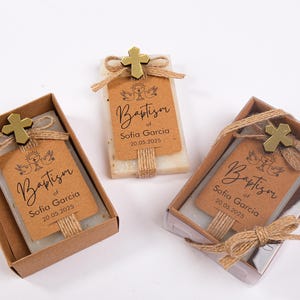 These beautiful handmade scented soap favors are a thoughtful gift for your special occasion. Ideal for baptisms, confirmations, christenings, first holy communions, quinceanera, sweet 16 or religious celebrations, each soap comes with a kraft paper tag customized with your guest of honor’s name, event date, and a personal message.

Each favor is topped with a rustic jute twine bow and a delicate charm, creating a charming and elegant presentation. Soaps are available in various scent-colors.