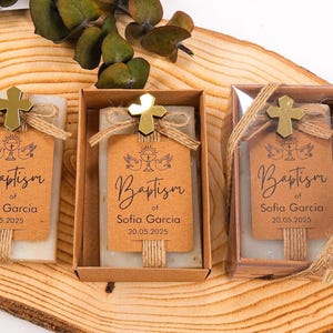 These beautiful handmade scented soap favors are a thoughtful gift for your special occasion. Ideal for baptisms, confirmations, christenings, first holy communions, quinceanera, sweet 16 or religious celebrations, each soap comes with a kraft paper tag customized with your guest of honor’s name, event date, and a personal message.

Each favor is topped with a rustic jute twine bow and a delicate charm, creating a charming and elegant presentation. Soaps are available in various scent-colors.