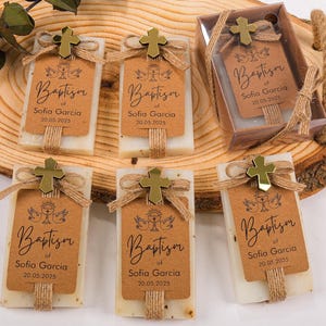 These beautiful handmade scented soap favors are a thoughtful gift for your special occasion. Ideal for baptisms, confirmations, christenings, first holy communions, quinceanera, sweet 16 or religious celebrations, each soap comes with a kraft paper tag customized with your guest of honor’s name, event date, and a personal message.

Each favor is topped with a rustic jute twine bow and a delicate charm, creating a charming and elegant presentation. Soaps are available in various scent-colors.