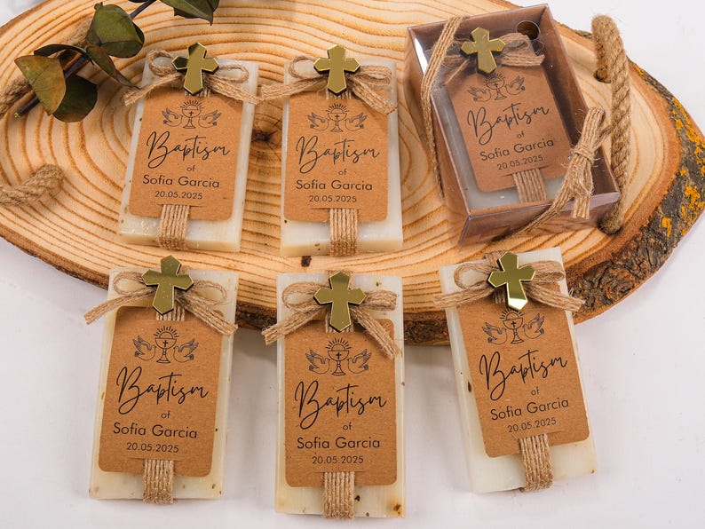 These beautiful handmade scented soap favors are a thoughtful gift for your special occasion. Ideal for baptisms, confirmations, christenings, first holy communions, quinceanera, sweet 16 or religious celebrations, each soap comes with a kraft paper tag customized with your guest of honor’s name, event date, and a personal message.

Each favor is topped with a rustic jute twine bow and a delicate charm, creating a charming and elegant presentation. Soaps are available in various scent-colors.