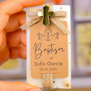 These beautiful handmade scented soap favors are a thoughtful gift for your special occasion. Ideal for baptisms, confirmations, christenings, first holy communions, quinceanera, sweet 16 or religious celebrations, each soap comes with a kraft paper tag customized with your guest of honor’s name, event date, and a personal message.

Each favor is topped with a rustic jute twine bow and a delicate charm, creating a charming and elegant presentation. Soaps are available in various scent-colors.