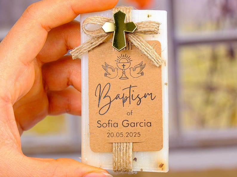 These beautiful handmade scented soap favors are a thoughtful gift for your special occasion. Ideal for baptisms, confirmations, christenings, first holy communions, quinceanera, sweet 16 or religious celebrations, each soap comes with a kraft paper tag customized with your guest of honor’s name, event date, and a personal message.

Each favor is topped with a rustic jute twine bow and a delicate charm, creating a charming and elegant presentation. Soaps are available in various scent-colors.