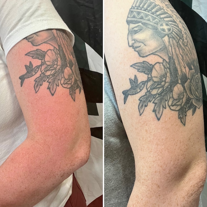 May include: A black and gray tattoo of a Native American chief wearing a headdress with feathers, a hummingbird, and flowers on a person's arm.