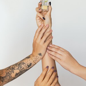 Hands holding vegan aloe vera serum, cruelty-free natural skincare