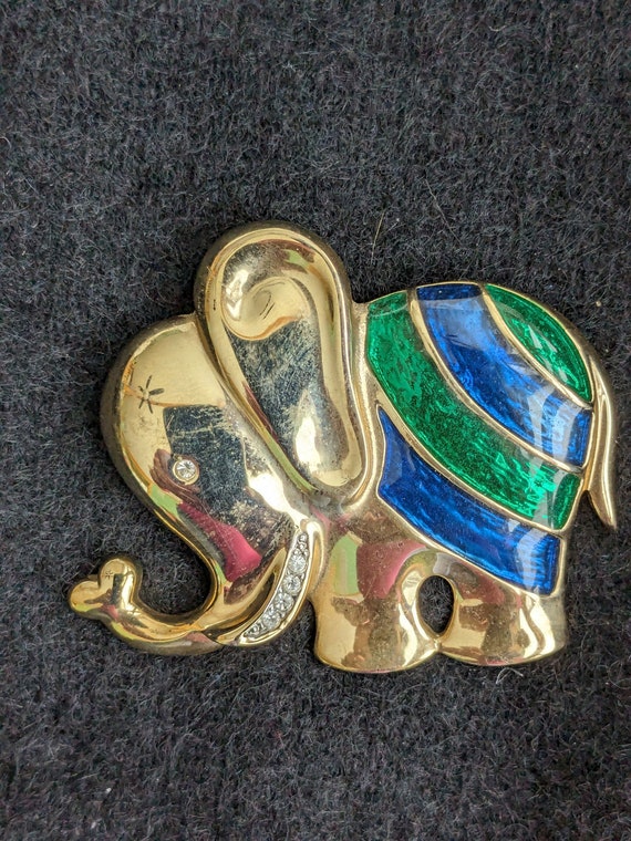 Gold tone elephant brooch