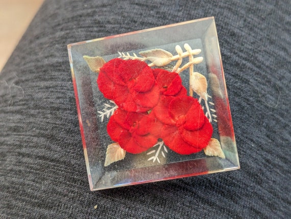 Lucite brooch pin with reverse carved red flowers - image 1