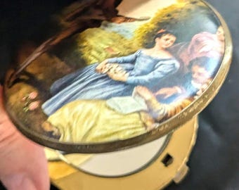 Miroir vintage double compact, régulier et grossissant, scène de ménestrel en excellent état pour son âge