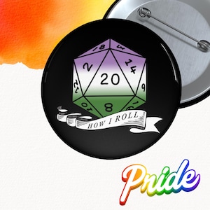 May include: A black button featuring a d20 die with the colors of the genderqueer pride flag. The die has the number 20 in the center. Below the die is a banner that reads "HOW I ROLL".