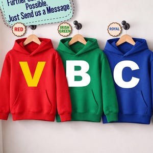May include: Four hooded sweatshirts in red, green, blue, and gray, each featuring a large letter on the front: yellow V, white B, white C, and black D. Text above reads: All Letters and Colors Available! Further Customization Possible. Just Send us a Message.