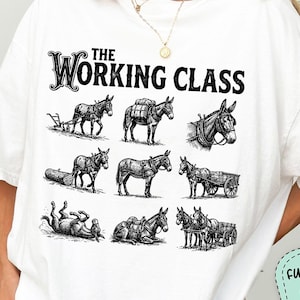 May include: White t-shirt featuring a black graphic of donkeys in various working poses, with the text "THE WORKING CLASS". The shirt includes a customizable option for farm or family names and print colors.