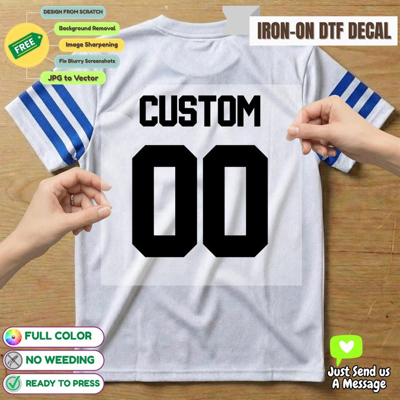 May include: White t-shirt with blue stripes on the sleeves, featuring a black "CUSTOM 00" iron-on DTF decal. The image includes text indicating full colour, no weeding, and ready to press. Additional text says "Just Send us A Message".