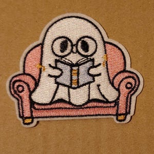 Bed Sheet Ghost on a sofa reading a book Embroidered Patch: Spooky Halloween Applique