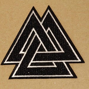 May include: Black and white embroidered patch featuring a triple triangle symbol, also known as the Valknut, a symbol from Norse mythology.