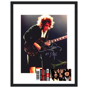 AC/DC, Angus Young in a Quality Glass Framed, Reproduction, Autograph, Photo and ticket, Signed by the Legendary Rock artist Collectable