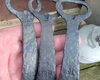 Hand forged bottle opener