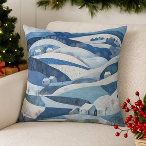Funda de cojín invernal con diseño de paisaje: decoración navideña de patchwork sintético azul y blanco.