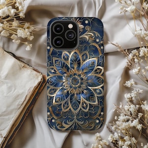 May include: A blue and gold phone case with a mandala design. The case has a cutout for the camera lens.