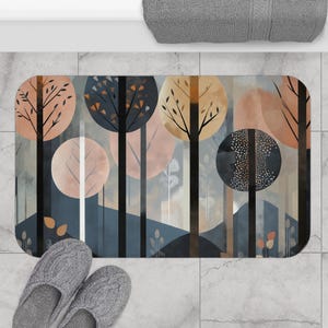 May include: Abstract bath mat with a forest scene featuring trees, leaves, and circles in shades of brown, beige, and blue.