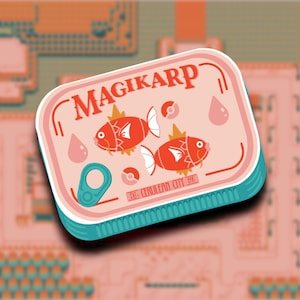 May include: A pink and blue can with the text "MAGIKARP" printed on the front. The can features two red fish with yellow fins and a white background. The text "EST. CERULEAN CITY 880" is printed on the bottom of the can.