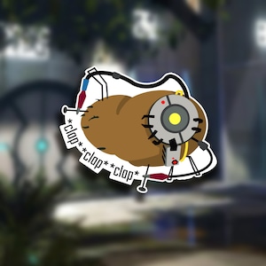 May include: A brown potato with a robotic eye attached to it. The potato has a red dot on it and the eye has a yellow lens. The potato is attached to a black wire with a red and blue wire coming out of it. The text *clap* *clap* *clap* is written on the image.