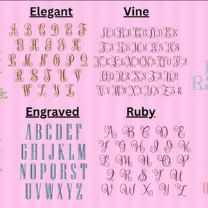 May include: A pink background displays various alphabet fonts, including Victorian, Elegant, Vine, Vintage, Ryan, Engraved, Ruby, and Bailey. Each font showcases the letters A through Z, offering diverse design options.