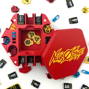 May include: A red, hexagonal game box with the text "NeuroFear" in yellow. The box is open, revealing yellow game pieces. Various game components, including SD cards and bug-shaped tokens, are scattered around.