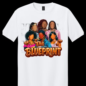 May include: White t-shirt featuring a graphic of five women with various hairstyles and jewelry. The text "The BLUEPRINT" is displayed in a brown, 3D font. The design includes pink and brown heart accents.