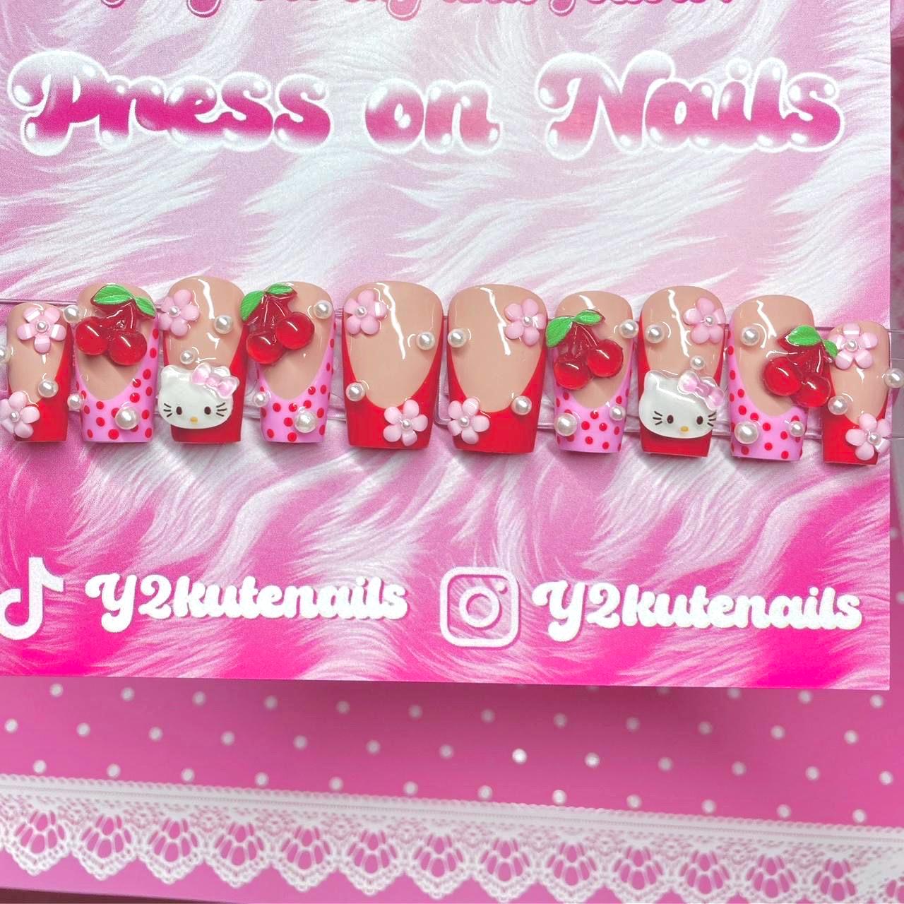 Bonjour kitty, appuyez sur les ongles