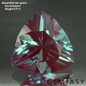 May include: A lab-grown Alexandrite gemstone with a triangular cut. The gem is a mix of burgundy and teal colors, with a size of 6x6x6mm and a weight of 0.71 ct. The image includes the text "Alexandrite lab-grown" and "GEMTASY".