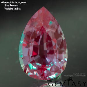 May include: A lab-grown Alexandrite gemstone in a pear shape, measuring 9x6mm and weighing 1.62 ct. The gem displays a mix of red and teal colors with multiple facets. The image includes the text "Alexandrite lab-grown Size 9x6mm Weight 1.62 ct".